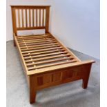 A GOOD QUALITY MODERN SOLID OAK SINGLE BED FRAME.