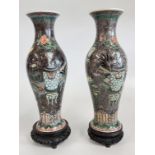 AN IMPRESSIVE MATCHED PAIR OF CHINESE PORCELAIN QING DYNASTY PERIOD VASES OF ELONGATED BALUSTER
