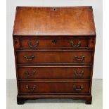 A REPRODUCTION MAHOGANY FOUR DRAWER FALLING FRONT WRITING BUREAU.