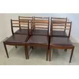 A SET OF MID CENTURY "G-PLAN" TEAK LADDER BACK DINING CHAIRS, BEARING ORIGINAL LABEL.