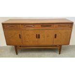 A MID CENTURY "G-PLAN" TEAK 3 OVER 4 DOOR SIDEBOARD, BEARING ORIGINAL LABEL, W 152 X D 46 X H 85CM.