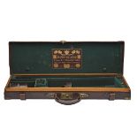 JOSEPH LANG & SON LD. A BRASS-CORNERED OAK-LINED LEATHER SINGLE GUNCASE, fitted for 27in. barrels (