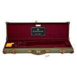 BRADY A LIGHTWEIGHT CANVAS AND LEATHER SINGLE GUNCASE, fitted for 26in. barrels, the interior