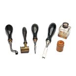 A GROUP OF VINTAGE GUNCASE ACCESSORIES, comprising of a turn-screw, nipple key, disc remover tool,