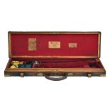 JAMES PURDEY & SON A BRASS-CORNERED OAK AND LEATHER SINGLE GUNCASE, fitted for 30in. barrels, the