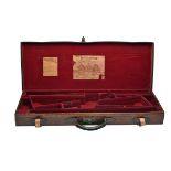 WILKINSONS A LEATHER DOUBLE GUNCASE, fitted for 28in. barrels (would adapt to 30in.), the lid