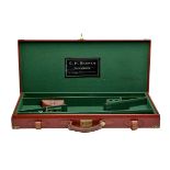 A BRASS-CORNERED OXBLOOD LEATHER DOUBLE GUNCASE, fitted for 26in. barrels, the interior lined with