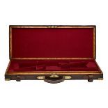 A BRASS-CORNERED OAK AND LEATHER DOUBLE GUNCASE, fitted for 28in. barrels (could adapt to 30in.),