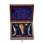 A CASED PAIR OF 180-BORE FLINTLOCK MUFF-PISTOLS SIGNED A. & E. WESTON, LEWES, no visible serial