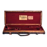 WILLIAM POWELL & SON A BRASS-CORNERED OAK AND LEATHER DOUBLE GUNCASE, fitted for 29in. barrels,