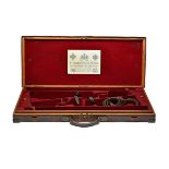 A BRASS-CORNERED OAK AND LEATHER DOUBLE GUNCASE, fitted for 29in. barrels (could adapt to 30in.),