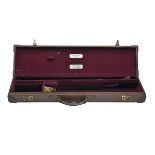 E.J. CHURCHILL LTD. A LEATHER 'V.C.' SINGLE GUNCASE, fitted for 25in. barrels, the interior lined