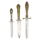 A GROUP OF THREE LATE 19th - EARLY 20th CENTURY SHEFFIELD CUTLERY-HILTED DAGGERS, the first