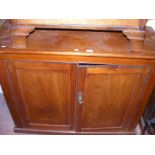 An antique Victorian mahogany two door cupboard -