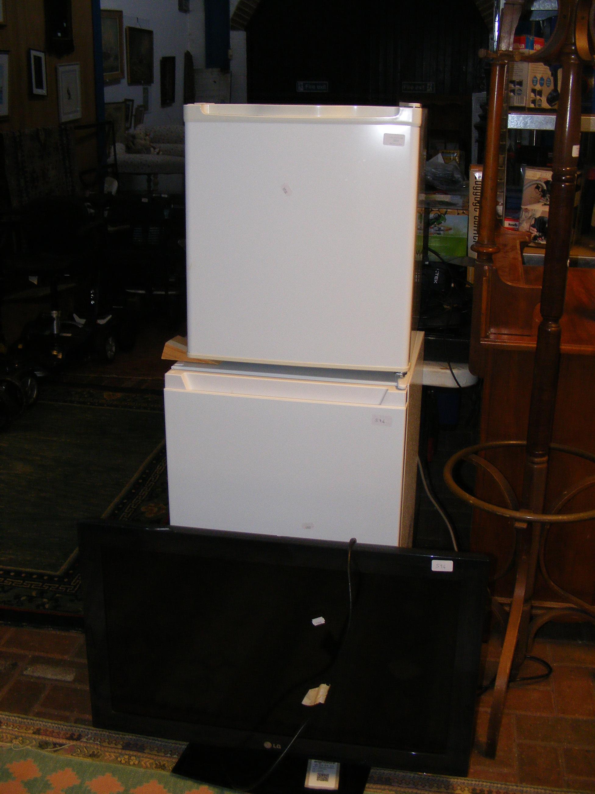An LG TV - Model 32LD450 - with power cable and remote, together with ...