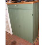 An Ikea pine and green painted two door cupboard w