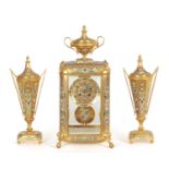 A FINE FRENCH GILT BRASS AND CHAMPLEVE ENAMELLED FOUR-GLASS MANTEL CLOCK GARNITURE RETAILED BY WILLI