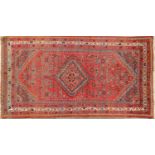 A LATE 19TH CENTURY PERSIAN WOOL RUG