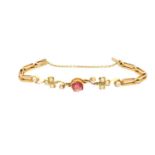 A LATE VICTORIAN/EDWARDIAN 15CT GOLD PALE RUBY AND SEED PEARL BRACELET