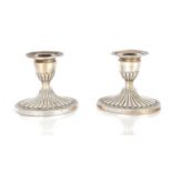 A PAIR OF EDWARD VII SILVER CANDLESTICKS
