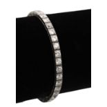 A LADIES' 18CT WHITE GOLD DIAMOND TENNIS BRACELET