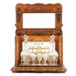 A 19TH CENTURY CARVED WALNUT FRENCH DECANTER LICQUOR CABINET