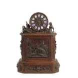 A LARGE 19TH CENTURY CARVED BLACK FOREST MANTEL CLOCK
