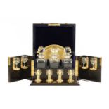 A FINE VICTORIAN CALAMANDER AND GIL BRASS MOUNTED SPIRIT TANTALUS LABELLED, BETJEMANN & SONS, LONDON