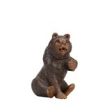 A 19TH CENTURY BLACK FOREST CARVED LINDENWOOD BEAR INKWELL