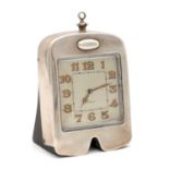 AN EARLY 20TH CENTURY SILVER DESK CLOCK MODELLED AS A CAR RADIATOR