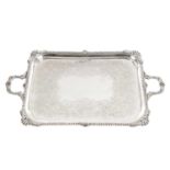 A LARGE EDWARDIAN ENGLISH SILVER TWIN-HANDLED TRAY