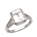 AN 18CT WHITE GOLD SAPPHIRE AND DIAMOND RING