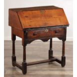 A CHARLES II APPLEWOOD BUREAU ON STAND