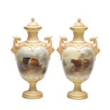 JOHN STINTON. A FINE PAIR OF ROYAL WORCESTER PORCELAIN OVOID PEDESTAL CABINET VASES AND COVERS