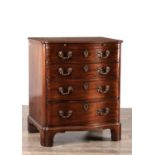 AN UNUSUAL GEORGE III STYLE MAHOGANY SERPENTINE CHEST OF DRAWERS WITH BRUSHING SLIDE