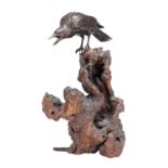 A MEIJI PERIOD JAPANESE BRONZE CROW ON ROOTWOOD BASE