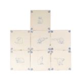 A COLLECTION OF SEVEN DUTCH DELFT TIN-GLAZED EARTHENWARE CAT TILES