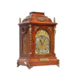 A LATE 19TH CENTURY GERMAN OAK AND ORMOLU MOUNTED QUARTER CHIMING BRACKET CLOCK