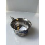 A CHINESE SILVER AND ENAMEL HANDLED CUP