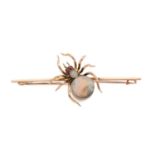 A VICTORIAN BLACK OPAL AND RUBY 9CT GOLD SPIDER BROOCH