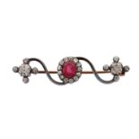 A 1930S RUBY AND DIAMOND PIN BROOCH