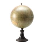 A TERRESTRIAL GLOBE ON EBONISED WOOD STAND