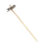 A FINE EDWARDIAN DIAMOND, RUBY AND GOLD HORSE AND JOCKEY TIE PIN