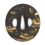 A JAPANESE GOLD INLAID AND SIGNED IRON TSUBA