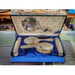 Cased Selfridges of London Silver Dressing table set comprising of Mirror, 4 Brushes and a Comb