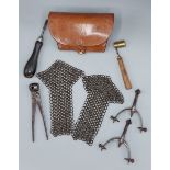 A leather ammunition pouch together with a bullet mould, two other similar implements, a pair of