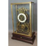 A 20th Century brass skeleton clock with enamel dial with Roman numerals, with two train movement