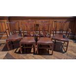 A set of six Chippendale style dining chairs, each with a carved splat back above a drop in seat