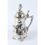 IN THE MANNER OF WMF, A PLATED STEIN WITH FIGURAL DECORATION. 42cms high.