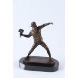 AFTER BANKSY. A bronze figure of a man throwing a bunch of flowers, on an oval marble base. 25cms